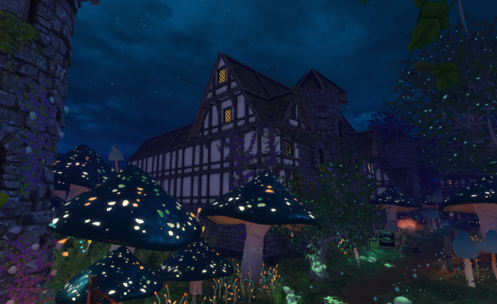 Under a dark blue, cloud filled sky, a Tudor style building of several stories, with steep gabled roofs, sits. There are lights on in some of its upper windows. In the foreground, ten foot tall mushrooms with brightly glowing coloured spots grow at the foot of a tall stone wall that fills the left edge of the frame. A path angles from the right foreground to the upper-right. It is bordered by pale green glowing flowers and smaller fungi.